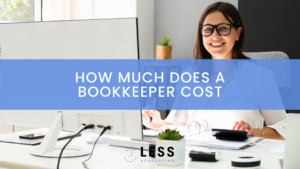 A woman sits at a desk. The article is about how much does a bookkeeper cost.