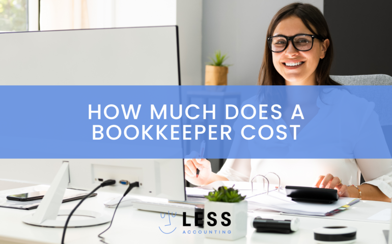 A woman sits at a desk. The article is about how much does a bookkeeper cost.