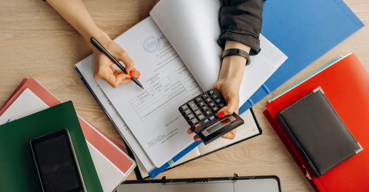 Bookkeeper analyzing financial documents